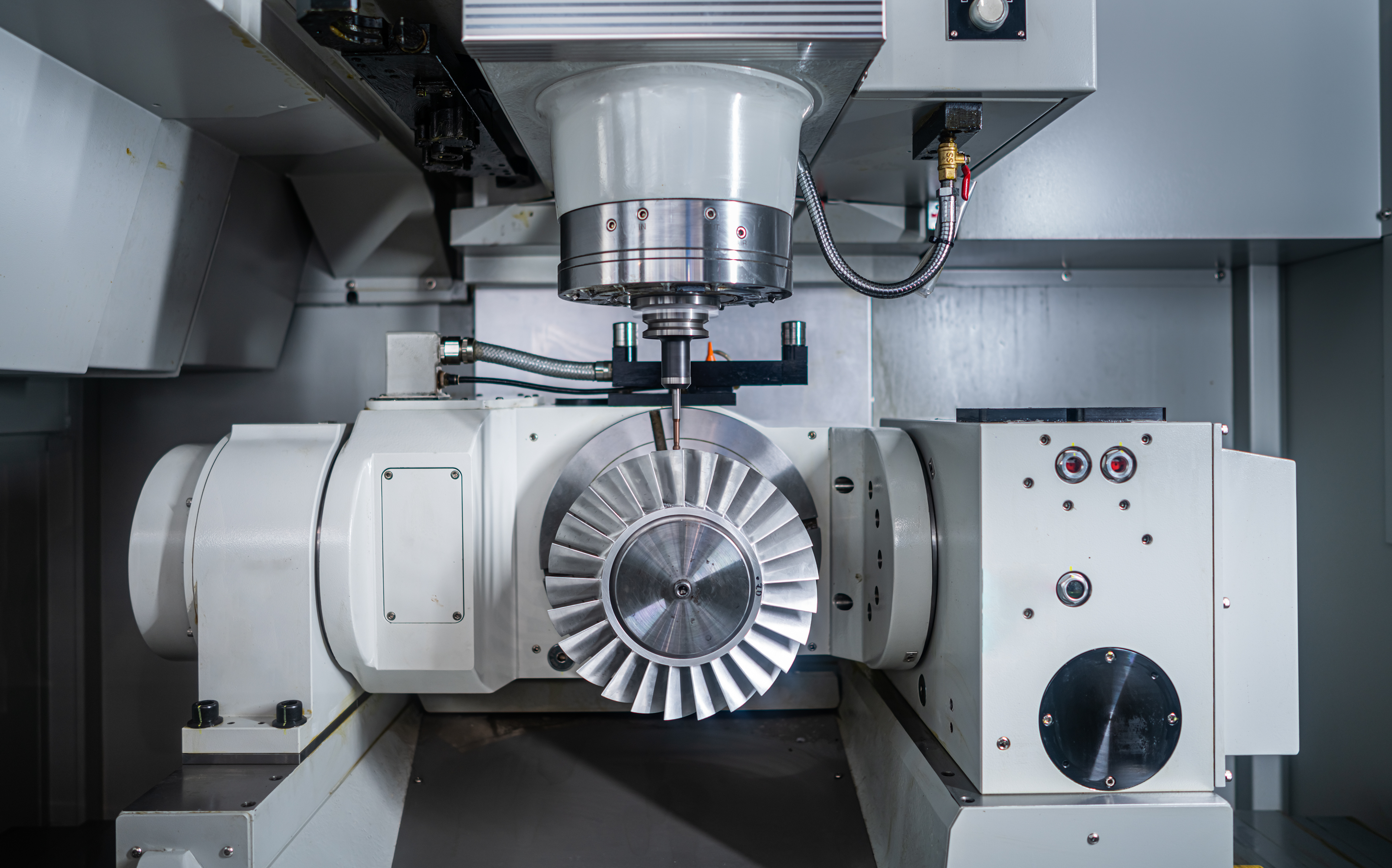 CNC machining equipment producing a precision engineering component in an ISO 9001-certified manufacturing environment.